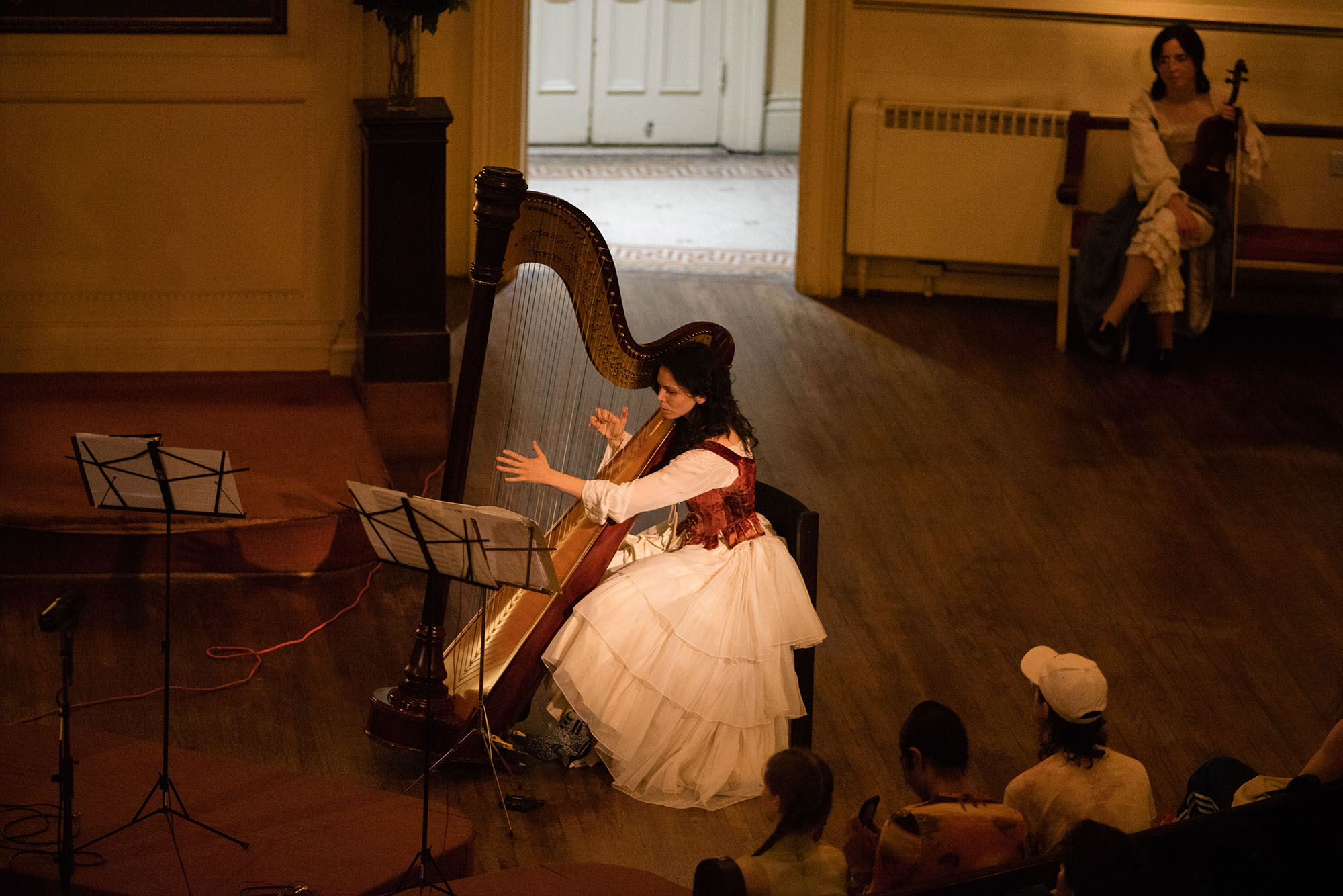 Esther Sibiude performing harp at Layfayette Presbyterian Church with COTC